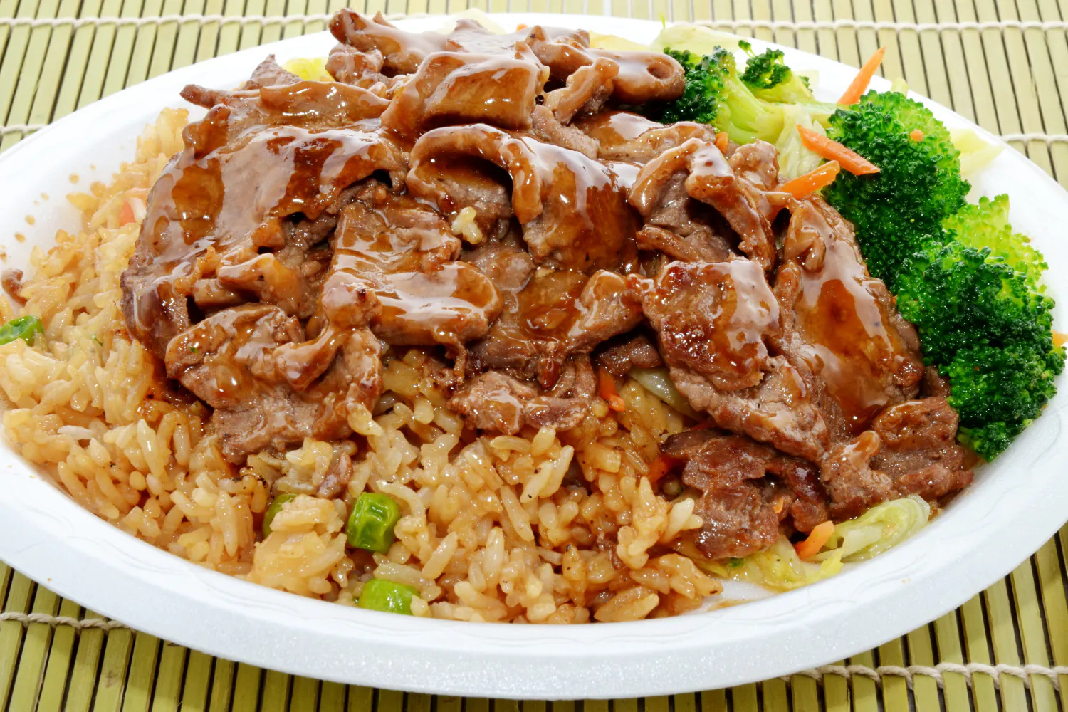 Black pepper beef fried rice plate with broccoli, cabbage and carrot strips at O E C Asian Fusion Restaurant in Picayune