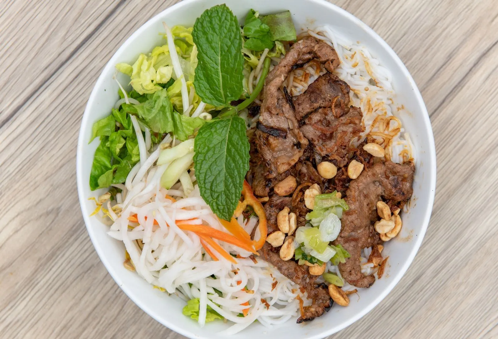 Vietnamese grilled beef vermicelli noodle salad with mint, peanuts and fresh greens at O E C Asian Fusion Restaurant in Picayune